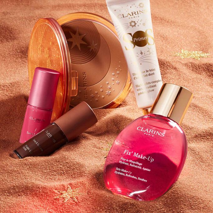 Showcase of essential summer beauty items, featuring sun powder, water lip stain, primer, and makeup fixer