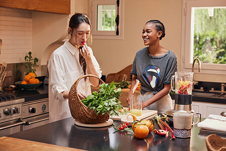 Lifestyle Visual of two women eating fruits